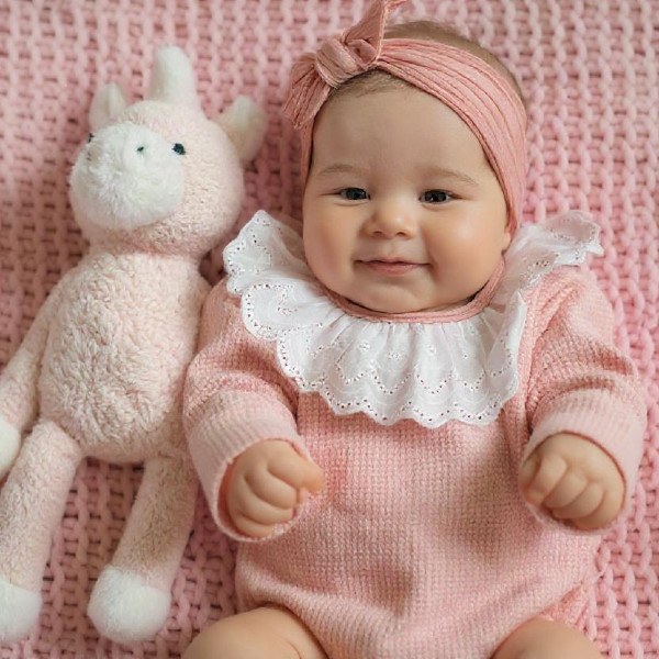 Baby with doll